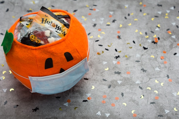 https://www.freepik.com/premium-photo/halloween-pumpkin-made-fabric-with-mask-filled-with-jelly-beans-decorated-with-halloween-motifs_10221951.htm#page=2&query=covid+halloween&position=11