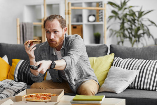 https://www.freepik.com/premium-photo/single-man-eating-pizza-while-watching-tv_8790699.htm#page=1&query=couch%20potato&position=39