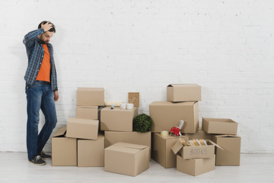 https://www.freepik.com/premium-photo/confused-young-man-looking-piles-cardboard-boxes-against-white-brick-wall_4273526.htm#page=4&query=moving&position=2