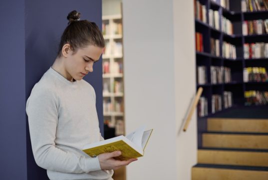 https://www.freepik.com/free-photo/student-with-hair-knot-standing-library-isolated-reading-information-open-textbook-his-hands-while-making-research_10897443.htm