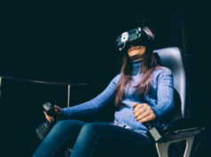 https://www.storyblocks.com/images/stock/young-beautiful-eastern-woman-sitting-on-a-gaming-chair-testing-augmented-reality-with-3d-viewer---games-futuristic-augmented-reality-concept-s6_bpn5yzj2c4awdq