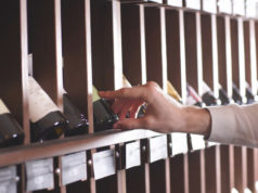 https://www.freepik.com/premium-photo/close-up-man-s-hand-selecting-bottle-wine-from-shelf-store_8201925.htm