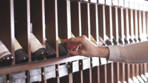 https://www.freepik.com/premium-photo/close-up-man-s-hand-selecting-bottle-wine-from-shelf-store_8201925.htm