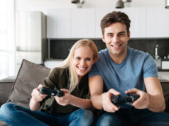 https://www.freepik.com/free-photo/happy-lovers-looking-camera-while-playing-video-games-home_6812721.htm
