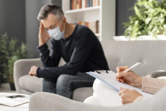 https://www.freepik.com/premium-photo/mid-shot-worried-man-with-mask-therapy-office-near-counselor_11241725.htm