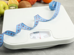 https://www.freepik.com/premium-photo/scales-measuring-tape-vegetarian-food-gray-floor_8996311.htm