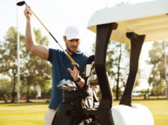 https://www.storyblocks.com/images/stock/handsome-male-golfer-taking-clubs-from-a-bag-in-a-golf-cart-at-the-green-course-rrxauntcbj7qoduh2