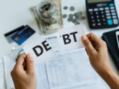 https://www.freepik.com/premium-photo/woman-hands-holding-up-piece-paper-with-word-debt-written-it-tearing-sheet-paper-half_7487475.htm#page=3&query=bankruptcy+money&position=27