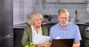 https://www.freepik.com/premium-photo/aged-couple-checking-finances-home-using-laptop-discussing-planning-budget-together-using-online-banking-services-calculator-holding-documents-kitchen_12715402.htm