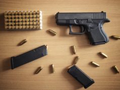 https://www.freepik.com/free-photo/gun-with-box-ammunition-bullets-wooden-wall_11030569.htm#page=1&query=handguns&position=48