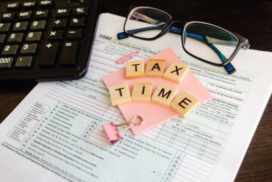 https://www.freepik.com/premium-photo/tax-time-wooden-letters-tax-form-with-sticker-glasses-calculator_9727994.htm