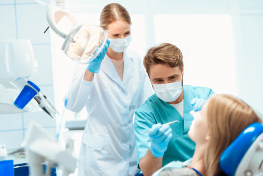 https://www.freepik.com/premium-photo/dentist-nurse-treat-patient-dental-office_4681445.htm#page=1&query=dentist&position=5