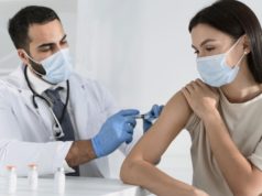 https://www.freepik.com/premium-photo/young-woman-being-vaccinated-by-doctor_11156679.htm
