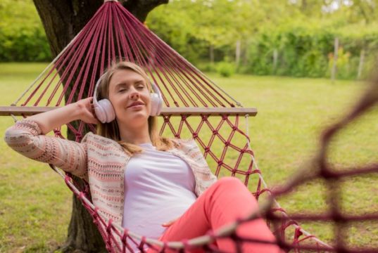 https://www.freepik.com/free-photo/close-up-portrait-woman-lying-down-hammock-listening-music-with-cell-phone-cheerful-girl-enjoy-red-hammock-outdoor-woman-relaxing-outside-listening-music-with-earphones_1191690.htm#page=2&query=backyard+enjoyment&position=3