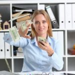 beautiful-businesswoman-portrait-scattering-money_151013-6490