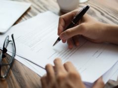 https://www.freepik.com/free-photo/businessman-examining-papers-table_1196253.htm