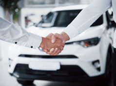 https://www.freepik.com/free-photo/close-up-sales-manager-black-suit-selling-car-customer_9276787.htm#page=1&query=car%20sales&position=0