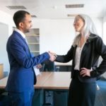 confident-partners-handshaking-greeting-meeting-room-successful-content-businessman-professional-grey-haired-manager-concluding-contract-teamwork-business-partnership-concept_74855-6926