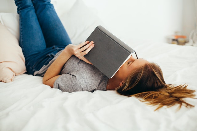 pexels-daria-shevtsova-1458669 https://www.pexels.com/photo/woman-lying-on-bed-holding-book-1458669/