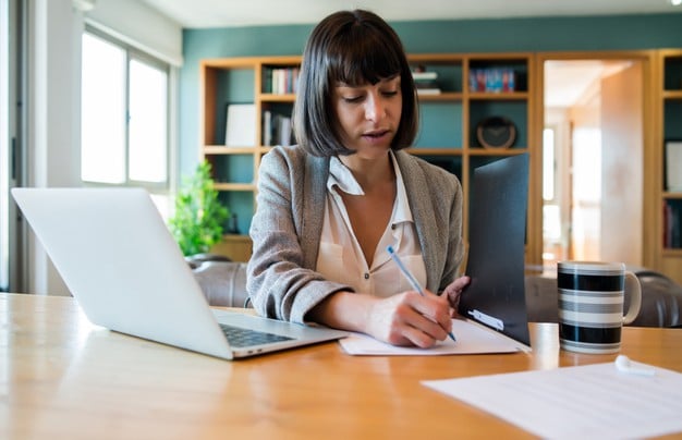 https://www.freepik.com/free-photo/portrait-young-woman-working-from-home-with-laptop-files-home-office-concept-new-normal-lifestyle_13414832.htm