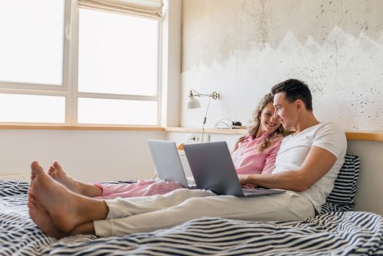 https://www.freepik.com/free-photo/young-couple-sitting-bed-morning-man-woman-working-laptop_13977567.htm#page=2&query=laptop+bed&position=10