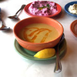 Turkish lentil soup with mezes (clockwise from upper left) muhammara, pink sultana, carrot tarator and haydari