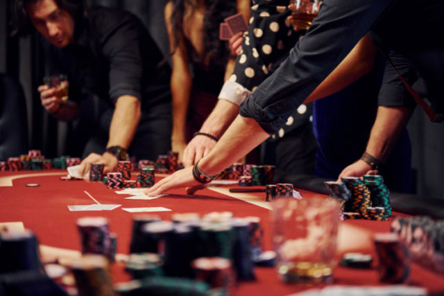 https://www.freepik.com/premium-photo/people-elegant-clothes-standing-playing-poker-casino-together_6657934.htm#page=1&query=gambling&position=12