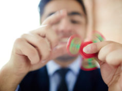 https://www.storyblocks.com/images/stock/young-man-rotating-fidget-spinner-in-hands-for-relief-sapq4pmzfjata2bvj