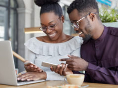 https://www.freepik.com/free-photo/black-woman-man-have-informal-meeting-glad-view-photos-smart-phone-wear-spectacles-work-together-common-project-via-laptop-computer_9592116.htm#page=1&query=couple%20computer&position=0