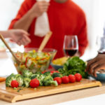 close-up-roommates-making-salad