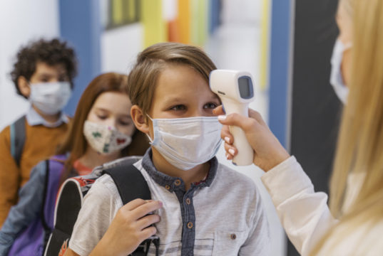 https://www.freepik.com/free-photo/female-teacher-with-medical-mask-checking-student-s-temperature-school_12367082.htm#page=2&query=covid%20school&position=43