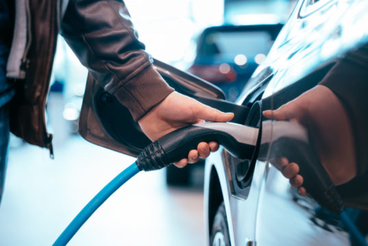 https://www.freepik.com/free-photo/human-hand-is-holding-electric-car-charging-connect-electric-car_8069535.htm#page=1&query=electric%20vehicles&position=11