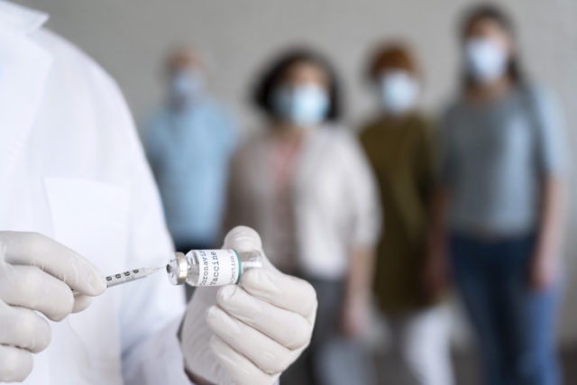 https://www.freepik.com/free-photo/male-medic-holding-vaccine-vial-with-syringe_14833603.htm