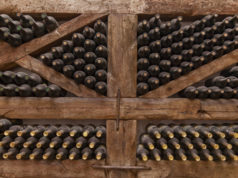 https://www.freepik.com/premium-photo/winy-bottles-lie-shelving-from-thick-logs-old-wine-cellars-with-bottles-barrels_17075633.htm?query=wine%20store