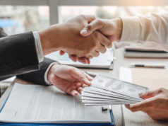 https://www.freepik.com/premium-photo/businessman-shaking-hands-giving-dollar-bills-corruption-bribery-business-manager-deal-contract_5288119.htm#page=1&query=money%20loan&position=25