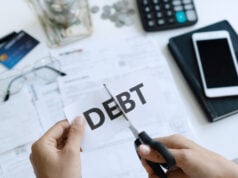 https://www.freepik.com/premium-photo/top-view-woman-hands-cutting-paper-with-word-debt-written-it_7749655.htm#page=1&query=debt&position=26