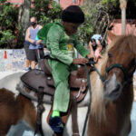 Client Aiden takes his first pony ride.