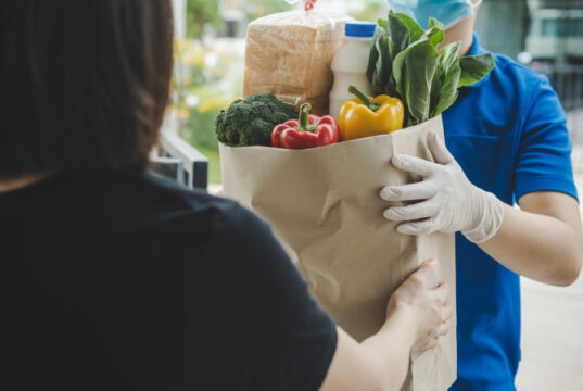 https://www.freepik.com/premium-photo/food-delivery-service-man-blue-uniform-wearing-protection-face-mask-holding-fresh-food-set-bag-customer-door-home-express-delivery-quarantine-virus-outbreak-takeaway-food-delivery-concept_8998077.htm#page=1&query=online%20grocery%20shopping&position=46&from_view=search