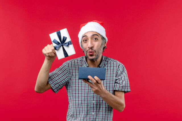 front-view-young-male-opening-christmas-present-red https://www.freepik.com/free-photo/front-view-young-male-opening-christmas-present-red_16940334.htm#query=christmas%20present%20open&position=29&from_view=keyword