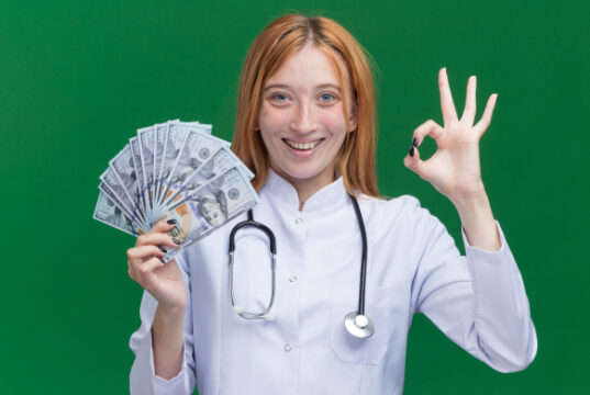 https://www.freepik.com/free-photo/joyful-young-female-ginger-doctor-wearing-medical-robe-stethoscope-holding-money-doing-ok-sign-isolated-green-wall_16464072.htm#query=doctor%20money&position=3&from_view=search