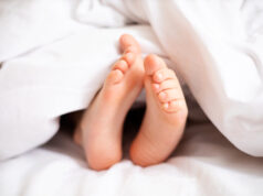 https://www.freepik.com/premium-photo/childrens-legs-stick-out-from-white-blanket-bedroom-dream-morning-lifestyle_23389355.htm#query=sleep%20feet&position=11&from_view=search
