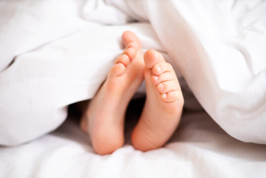 https://www.freepik.com/premium-photo/childrens-legs-stick-out-from-white-blanket-bedroom-dream-morning-lifestyle_23389355.htm#query=sleep%20feet&position=11&from_view=search