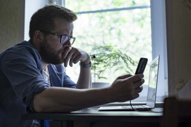 https://www.freepik.com/premium-photo/focused-bearded-man-wearing-glasses-is-holding-smart-phone-table-is-laptop_22647386.htm#query=using%20computer&position=13&from_view=search