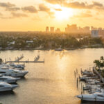 Luxury yacht parked on a canal with the sun coming down at Fort Lauderdale
