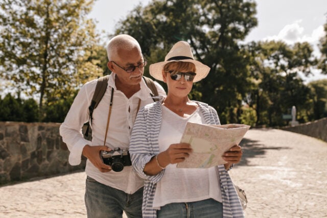 https://www.freepik.com/free-photo/modern-woman-white-tshirt-striped-blouse-hat-glasses-looking-map-walking-with-grey-haired-man-shirt-with-camera-outdoor_23937660.htm#query=senior%20travel&position=17&from_view=search