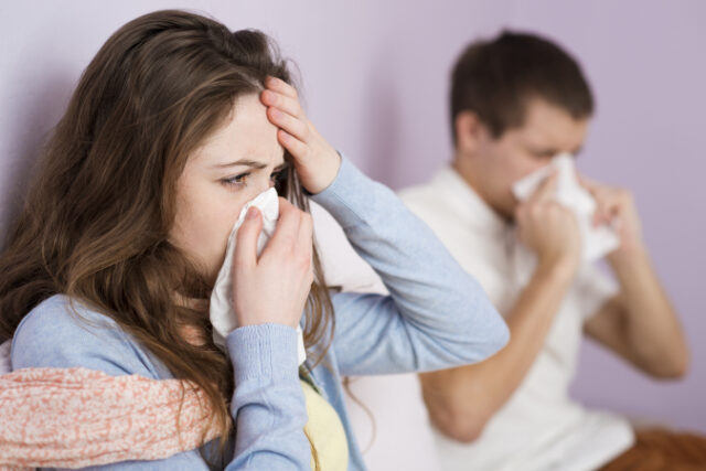 Sick woman and man have cold, flu and high fever. Asset ID: SBI-305124624