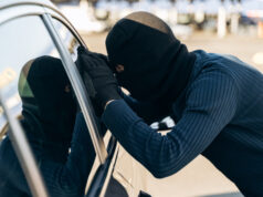 https://www.vecteezy.com/photo/3492195-man-dressed-in-black-with-a-balaclava-on-his-head-looking-at-the-glass-of-car-before-the-stealing-car-thief-car-theft-concept