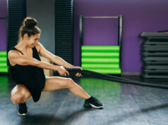https://www.vecteezy.com/photo/4676439-young-and-athletic-woman-using-training-ropes-in-a-gym