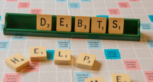 https://www.freepik.com/free-photo/closeup-debts-help-me-written-scramble-board-lights_10991012.htm#query=debt&from_query=debt%20consolidation&position=35&from_view=search