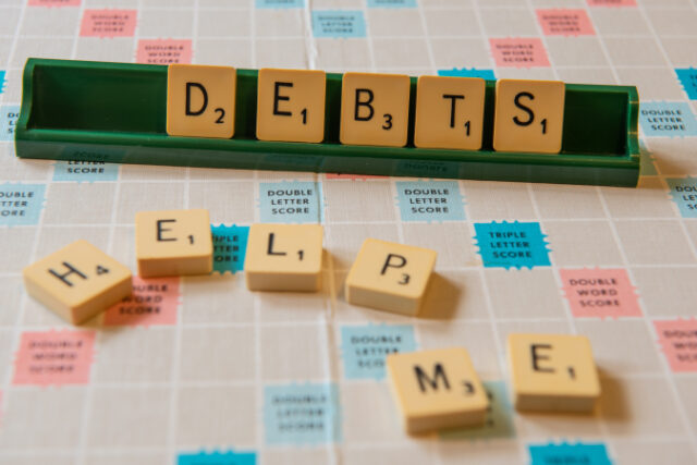 https://www.freepik.com/free-photo/closeup-debts-help-me-written-scramble-board-lights_10991012.htm#query=debt&from_query=debt%20consolidation&position=35&from_view=search